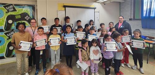  Students holding certificates